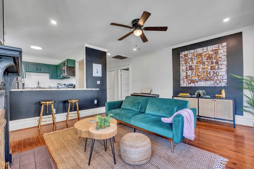 Modern design meets historic charm with rich hardwood floors, bold accents, and inviting furnishings that create a stylish gathering place for your entire group.
