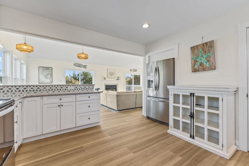 An open layout keeps the kitchen and living spaces connected, so no one has to miss a moment together