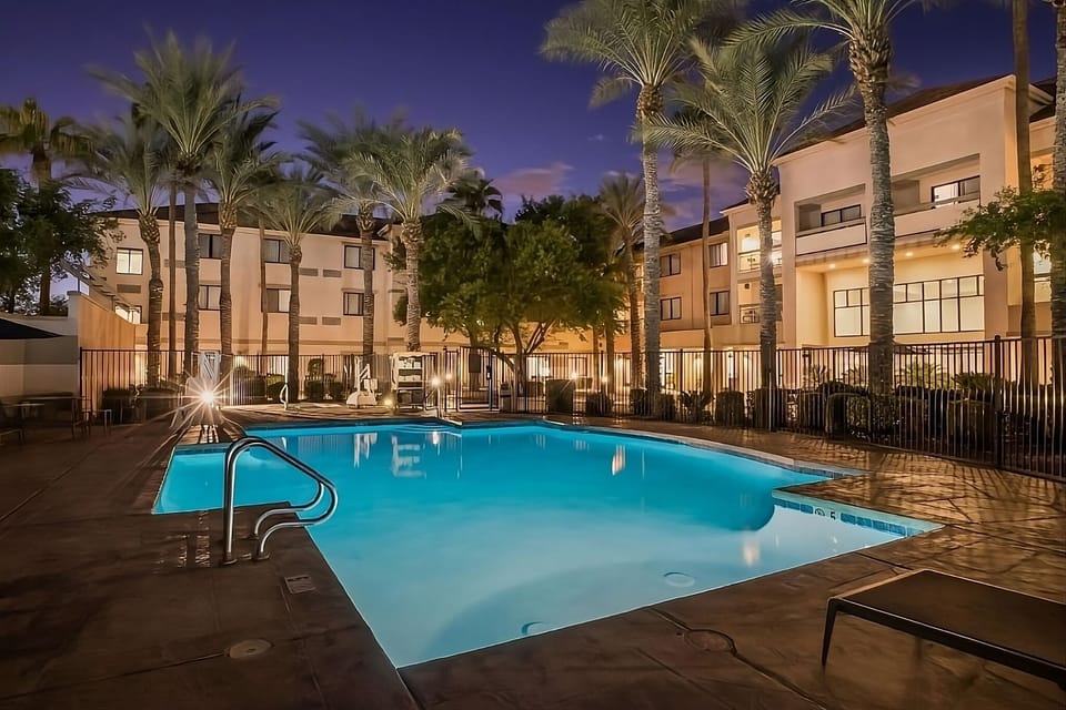 Unwind with an evening swim under warm courtyard lights.