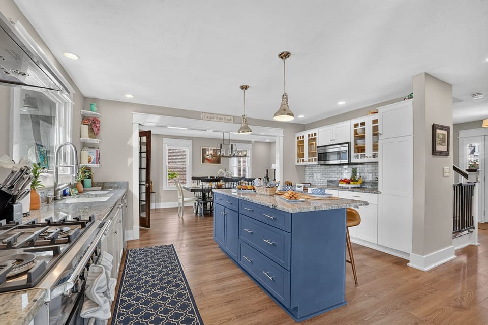 Fully equipped gourmet kitchen with a large island and modern appliances.