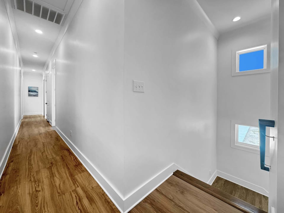 Head upstairs to explore more of this exceptional beach home​