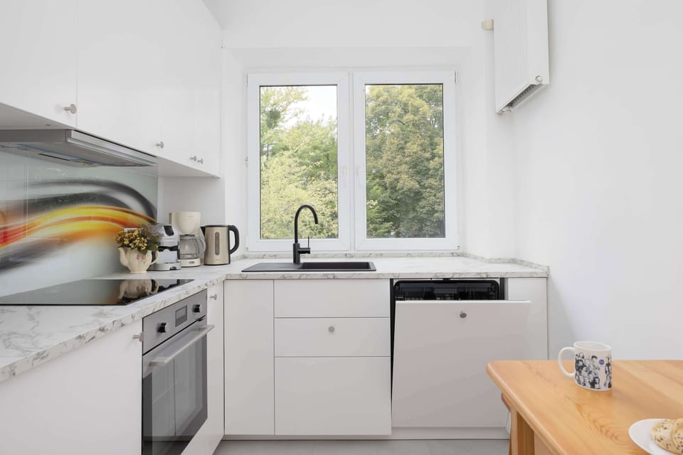 The kitchen's bright space is perfect for preparing meals.