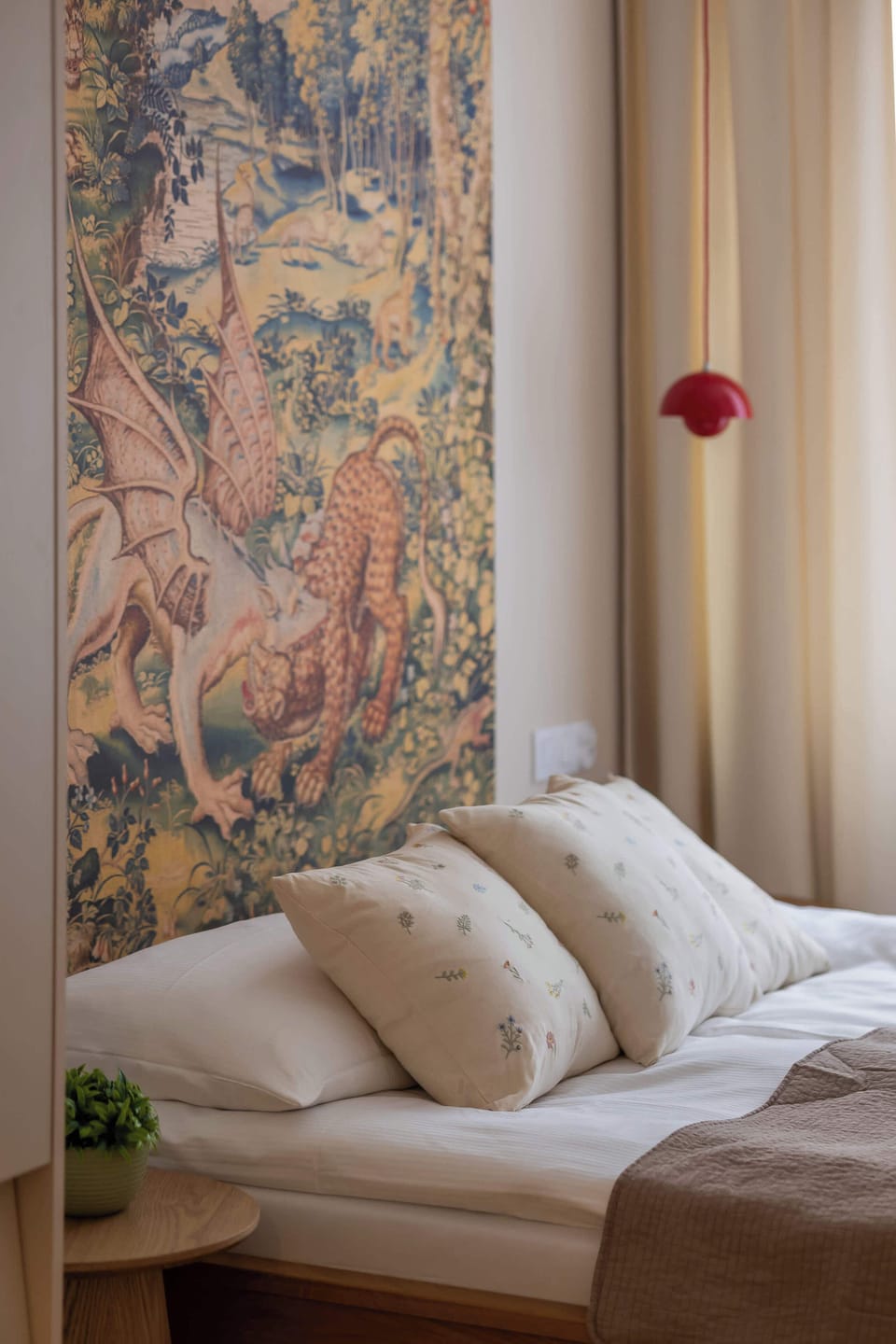 A large window in the bedroom allows for plenty of natural light.