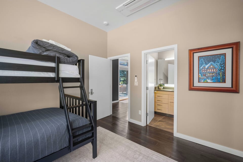 Step into your bunk-bedded room, where thoughtful details like fresh linens and an adjoining bathroom promise comfort and convenience for your whole group.