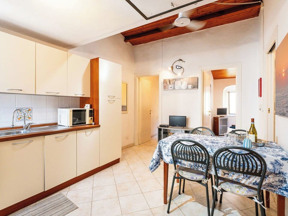 Flooring, Floor, Interior Design, Apartment, Furniture, Room, Ceiling, Chair, Wood Stain, Kitchen & Dining Room Table