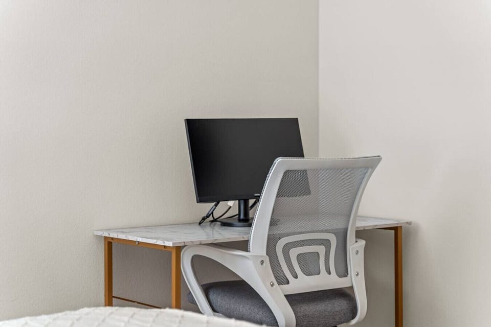 Stay productive in the dedicated workspace with a desk and comfortable chair.