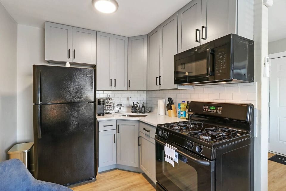 Prepare delicious meals in this well-equipped kitchen, complete with a full-sized refrigerator, stove, oven, microwave, and counter space.