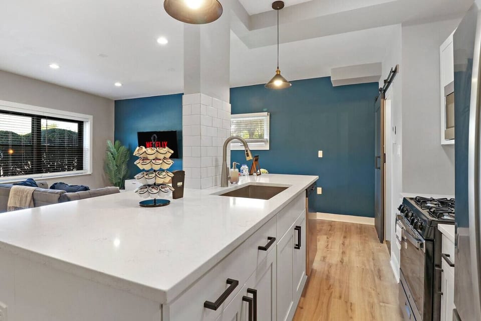 Perfect for entertaining! This open layout allows for easy interaction between the kitchen, dining, and living areas.