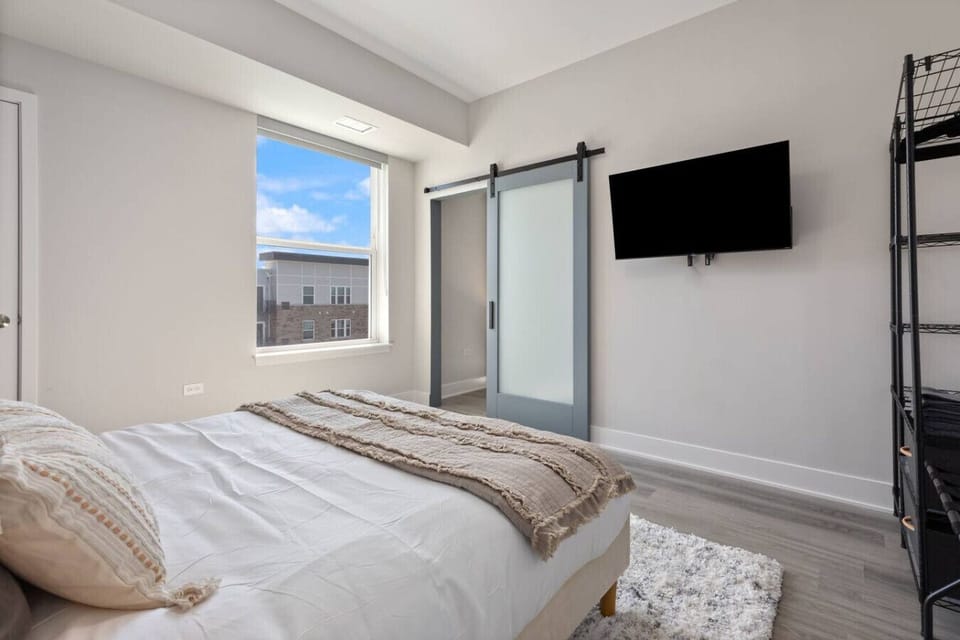 Relax and unwind in this bedroom featuring a comfortable bed.
