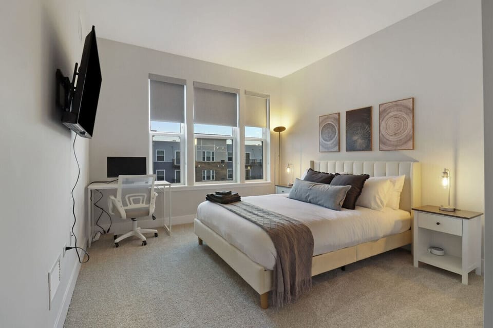 Relax and unwind in this bedroom featuring a comfortable bed, with dedicated workspace.
