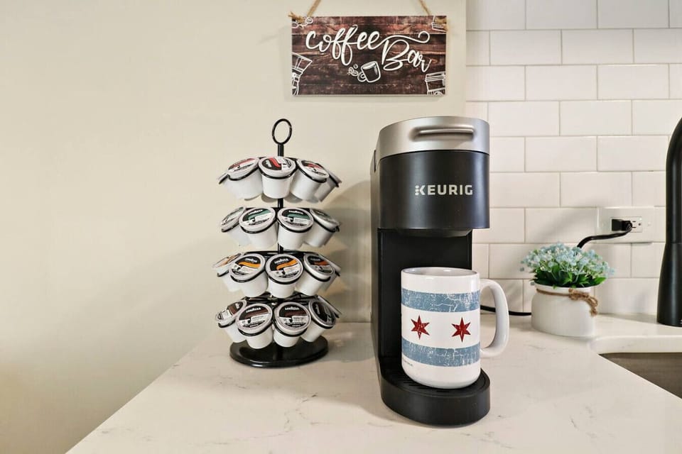 Keurig coffee maker and a selection of K-Cups provided.