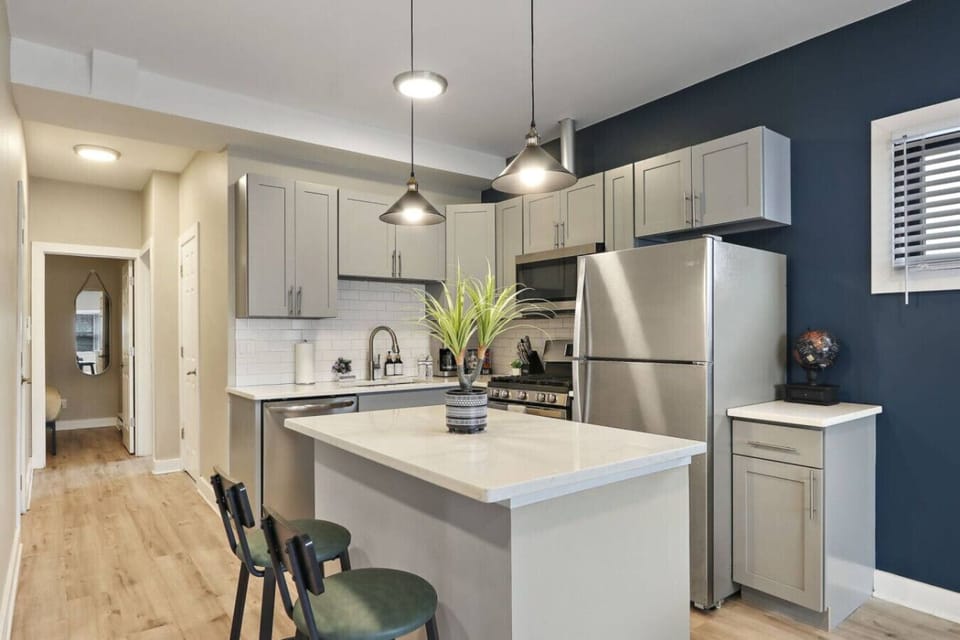 Kitchen with island and bar stools.