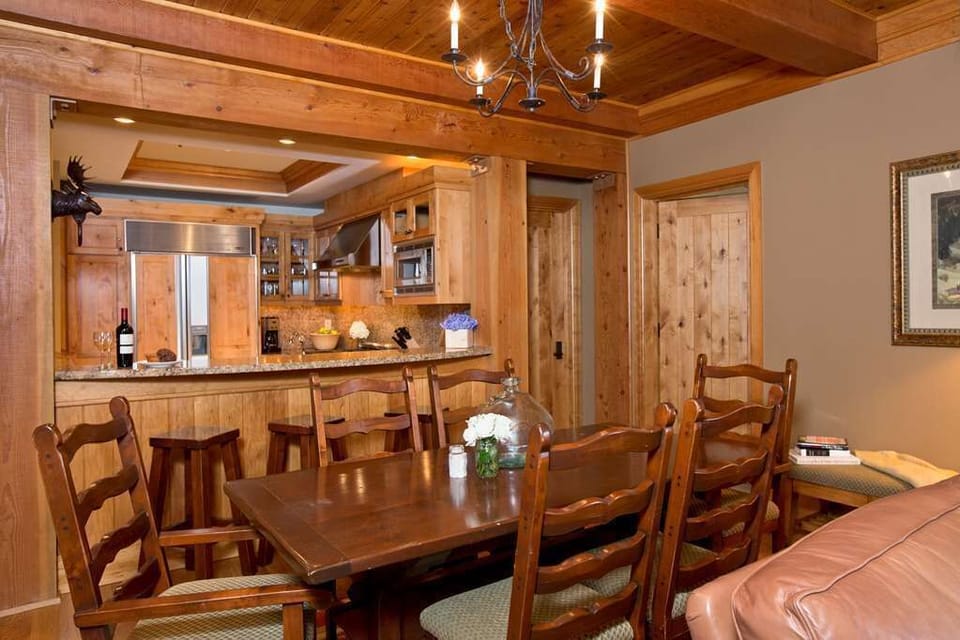 Rustic dining area beside the open kitchen and breakfast bar.