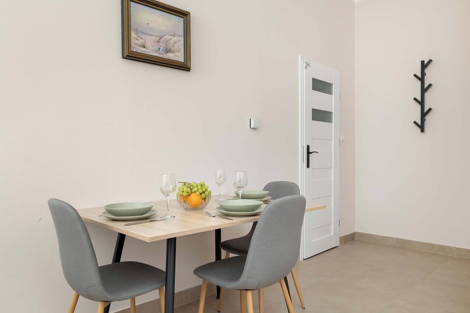A dining table with comfortable chairs. A perfect place to enjoy meals or plan your day.
