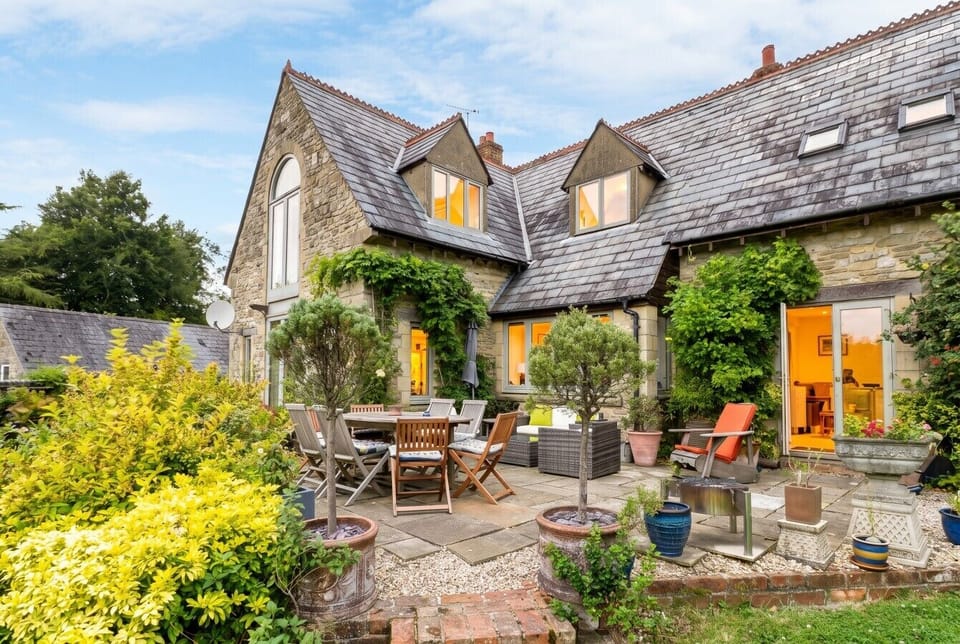 Sunny rear terrace made for long alfresco lunches