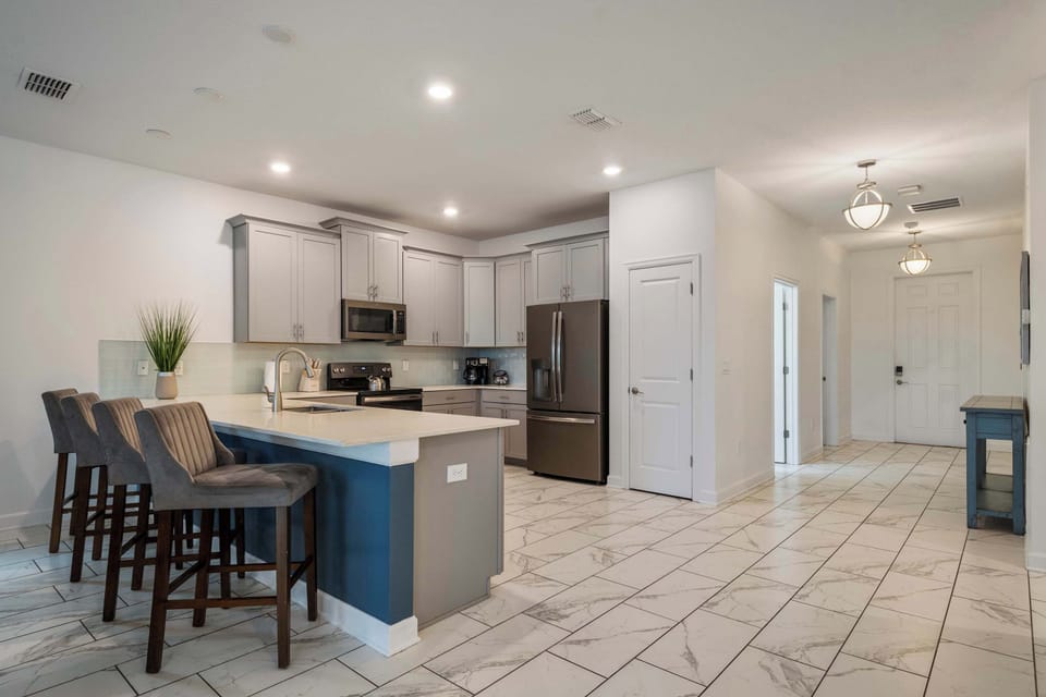 The heart of the home awaits! This fully equipped modern kitchen features generous counter space, stylish finishes, and comfortable seating, making it easy for family and friends to gather, cook, and connect.