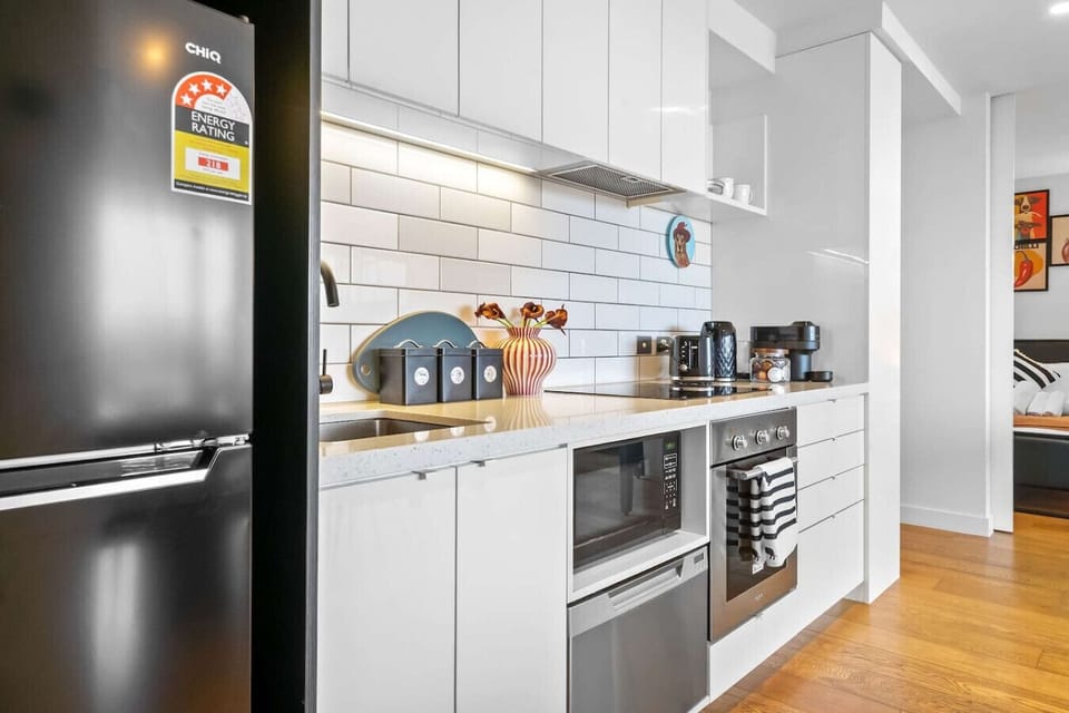 Modern, fully equipped kitchen with sleek finishes and all essentials for preparing meals during your stay.