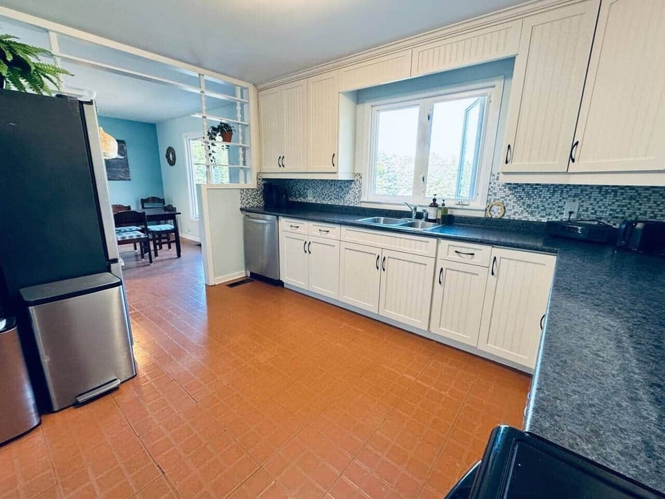 Full kitchen - dishwasher, oven, stove, microwave, large fridge. 