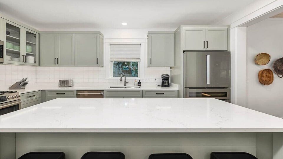 Your gourmet kitchen blends style and function with sleek marble countertops, modern appliances, and plenty of space to create memorable meals together.