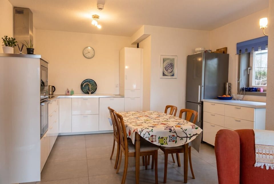 Spacious second kitchen and dining area for easy family cooking