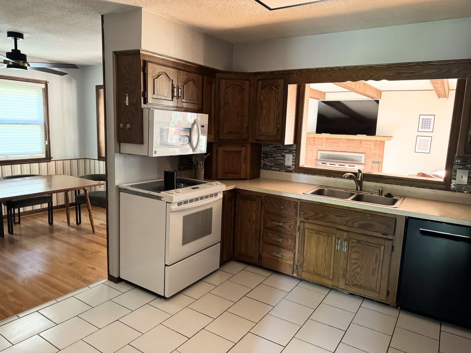 Bright kitchen with wood cabinetry and functional layout.