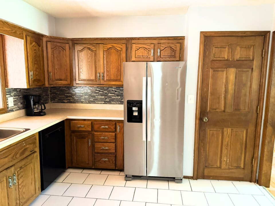 Clean modern kitchen with ample storage and practical design.