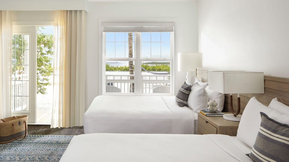 Wake up to sunshine pouring through wide windows by the beds.
