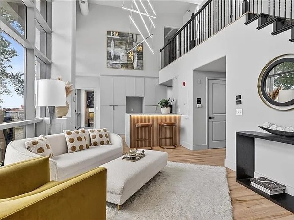 Bright, airy living room with soaring ceilings and elegant modern style.
