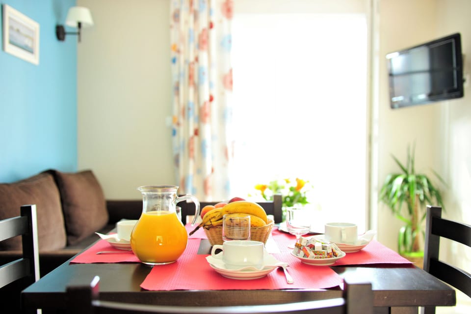 Bright mornings by the glass door leading out to the terrace and garden furniture beyond.