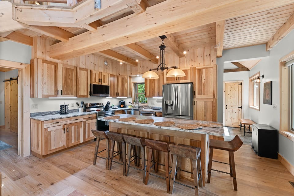 Kitchen and dining area with stainless appliances and granite countertops