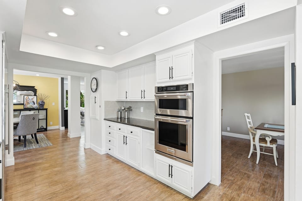  Kitchen centers between separate kitchen dining nook and large formal Dining Rm