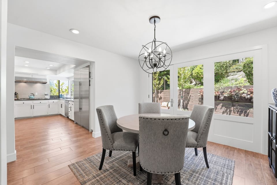 Open Floor Plan with new Windows and Doors Opening to Gorgeous Landcaped patios!