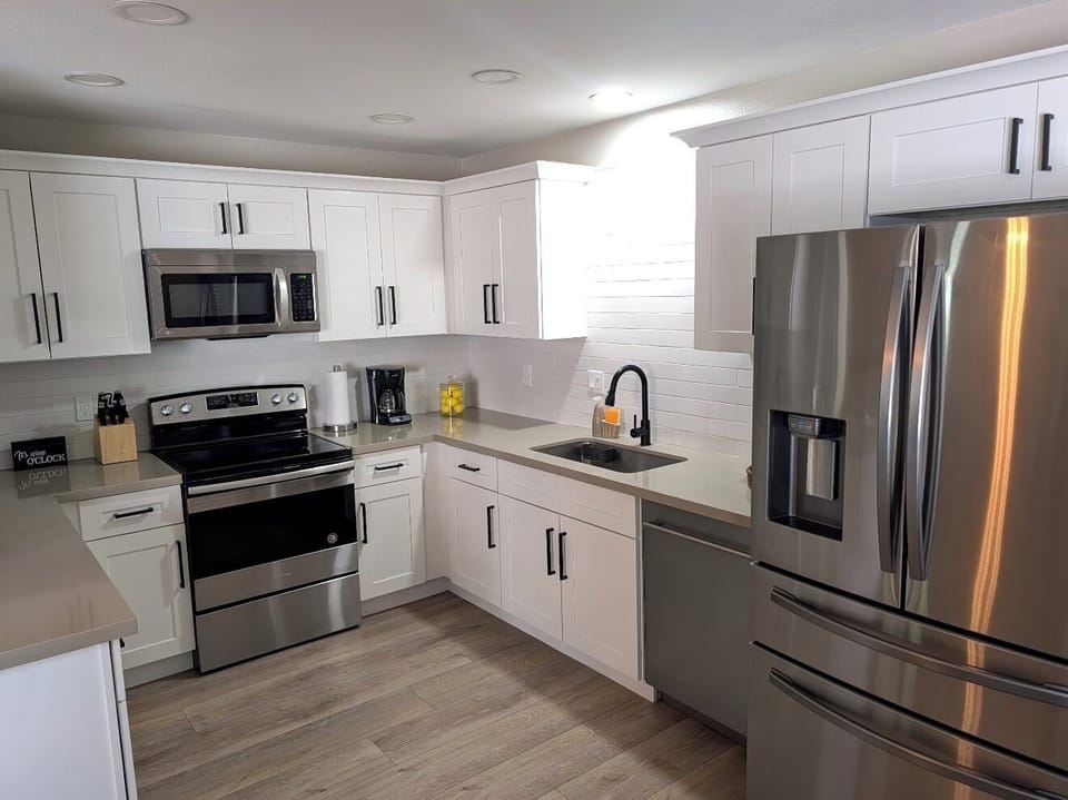Bright modern kitchen with stainless appliances and ample counter space