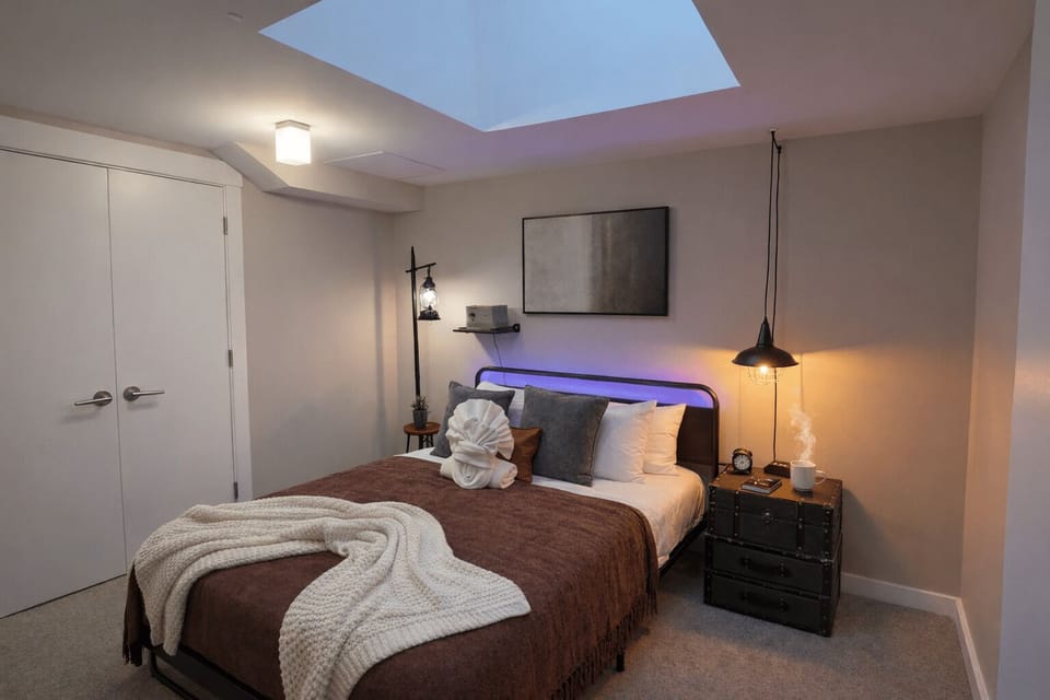 Private king bedroom with skylight and wall-size projection screen