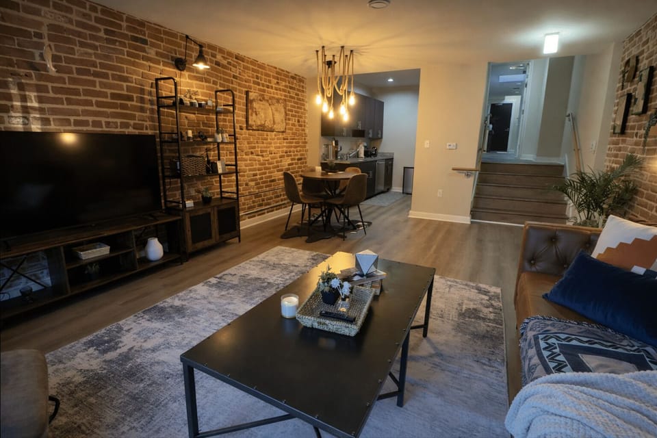 Open living room with smart TV, dining nook and easy kitchen access