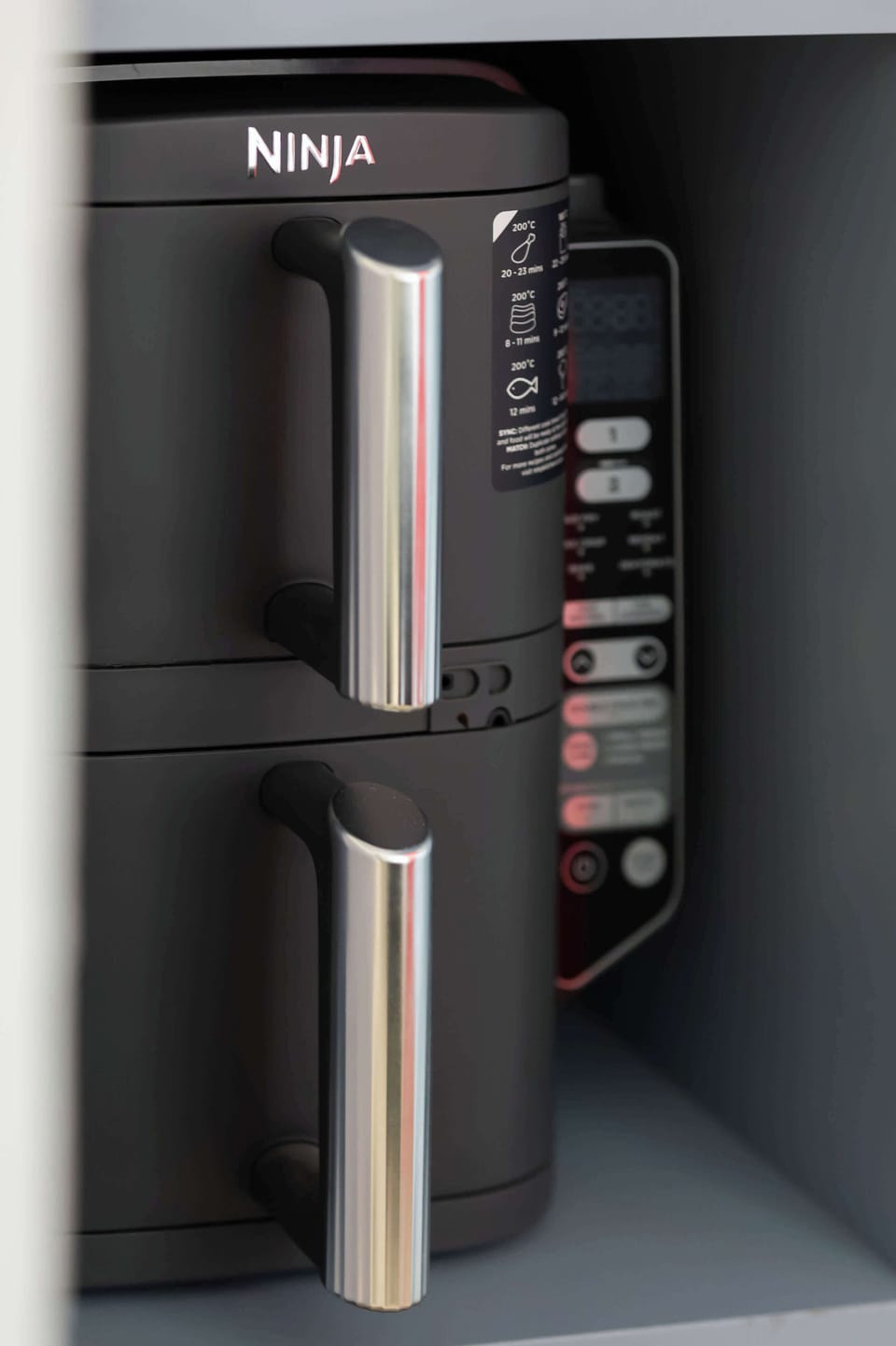 Compact air fryer available for guests, perfect for preparing quick and easy meals.