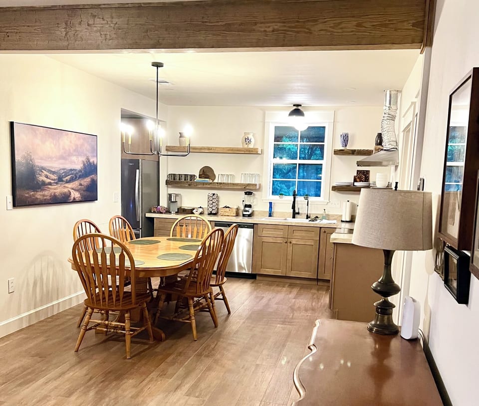Cozy farmhouse-style dining and kitchen space with seating for 6