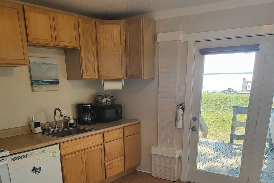 Full kitchen decked out for staying in and cooking a meal.
