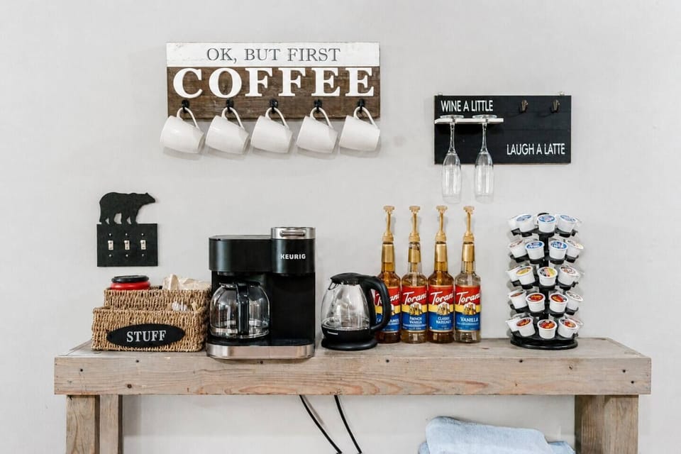 Fully stocked coffee bar — Keurig, flavored syrups & mugs galore ☕