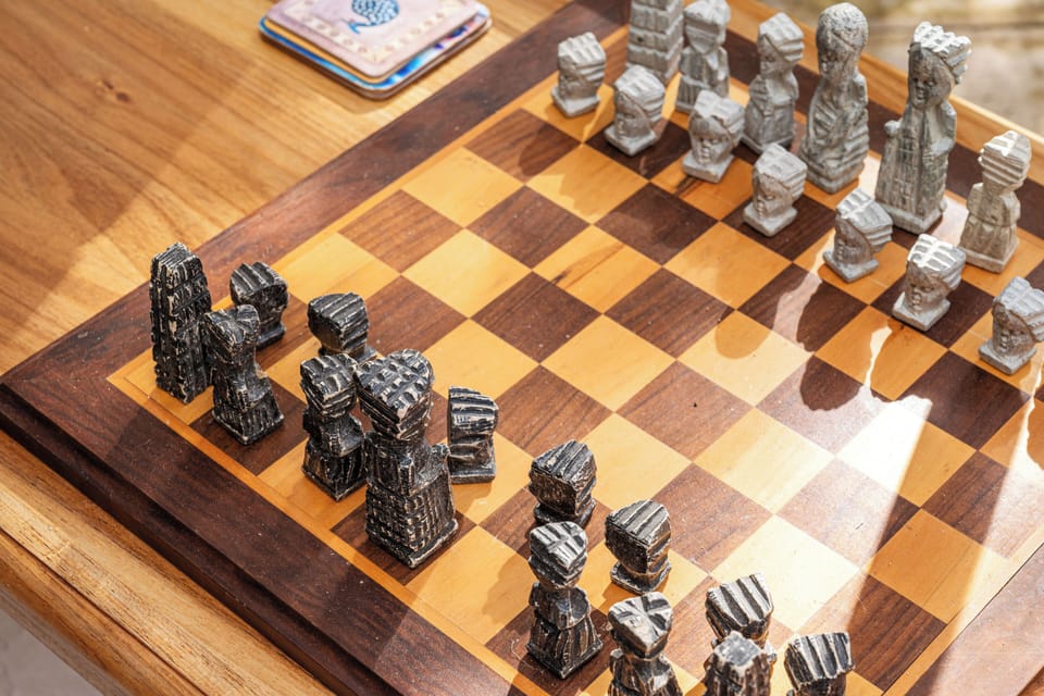 Challenge a fellow guest to a friendly match or unwind with a game of chess on this handcrafted wooden board.