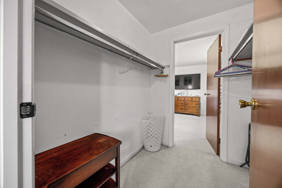 Large connecting closet provides ample space for luggage, clothing, and personal belongings.