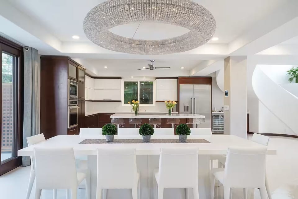 Bar seating wraps the island, keeping the cook in the conversation.