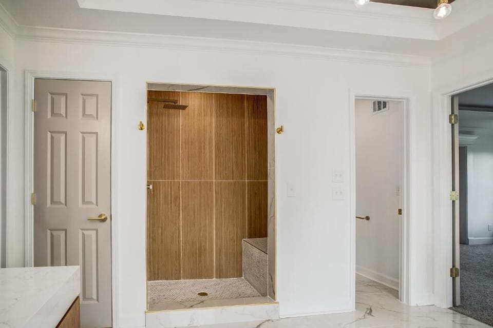 Modern walk in shower with spa like luxury finishes.