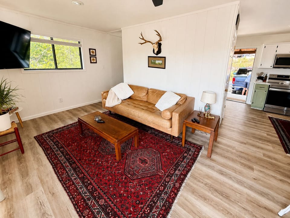 Bright living room with rustic charm and a cozy, welcoming feel.