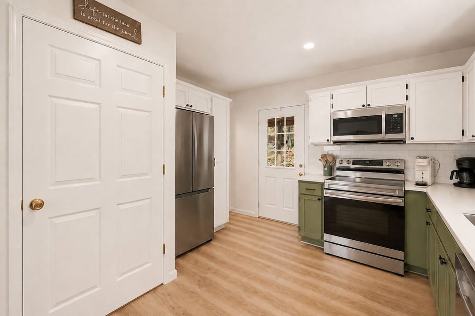Modern kitchen with stainless appliances and everything you need to cook.