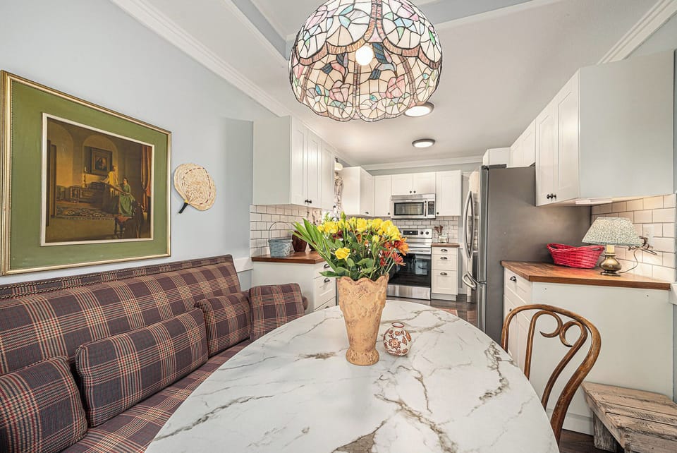 Cozy eat in kitchen with warm decor and inviting seating.