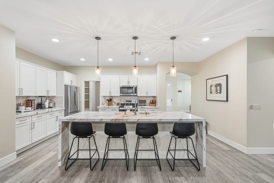 Bright modern kitchen with oversized island seating for 4