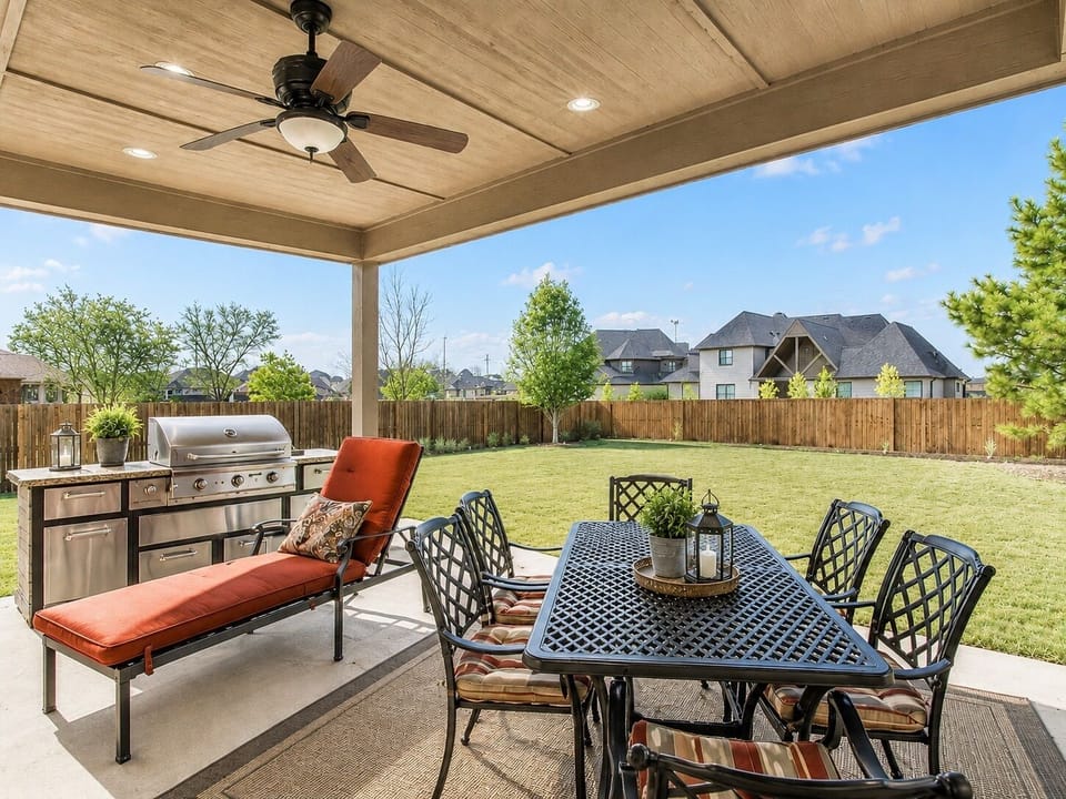 Covered patio ideal for dining, entertaining, and unwinding.