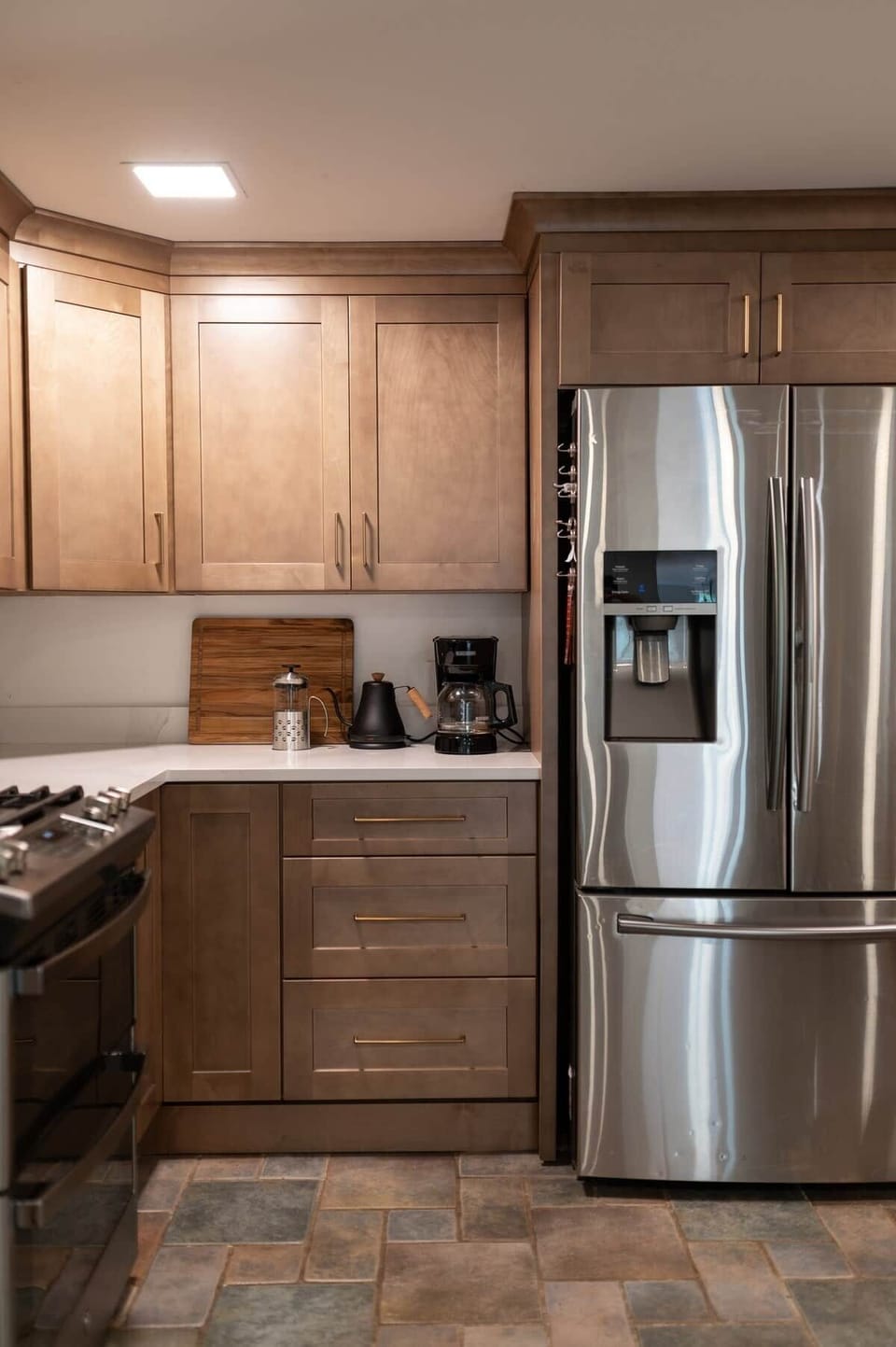 Choose your coffee-making preference: a drip coffee maker or a French press with an electric tea kettle