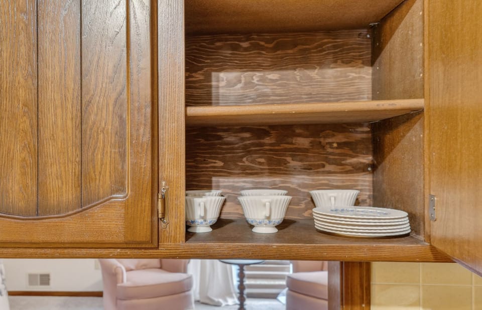 Beautiful custom cabinetry with open shelving and stylish kitchen details.